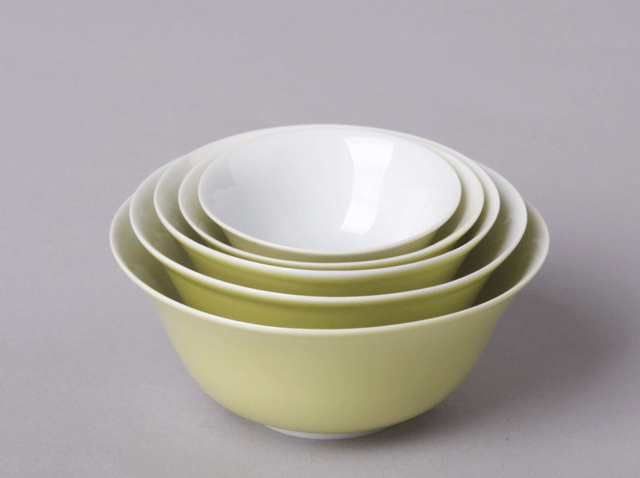 Nesting yellow and white glaze bowls