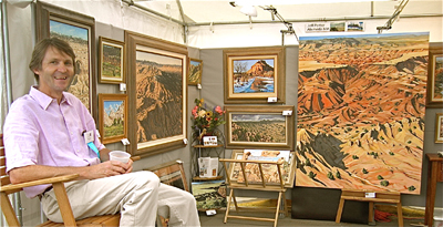 Jeff in his booth with new oil paintings at 2008 NM Arts and Crafts Fair