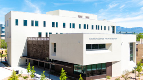 Photo of the exterior Anderson School of Management buildings UNM Campus