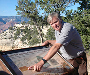 Professor Karlstrom pointing at sign