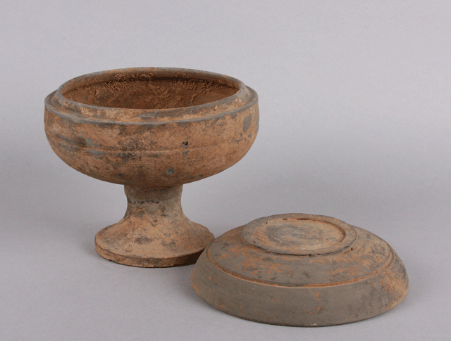 Covered food dish on pedestal